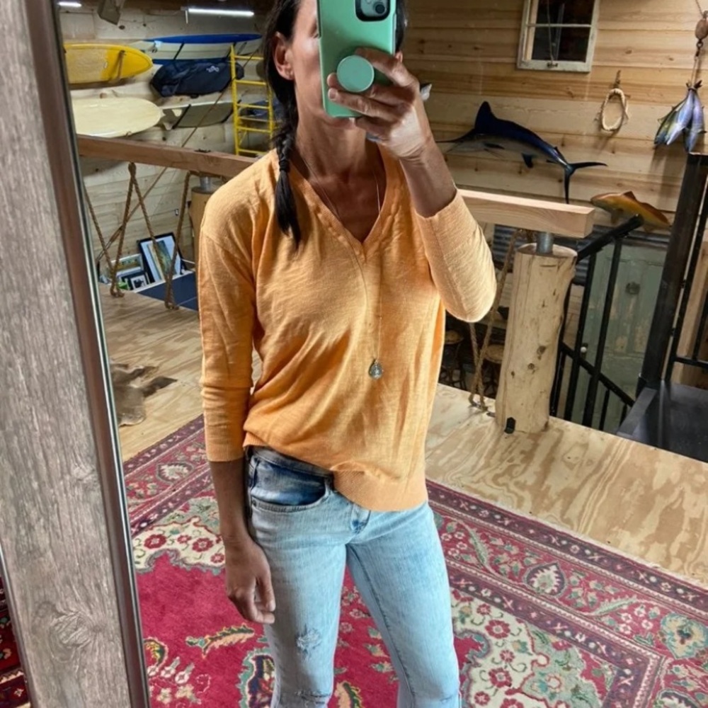 Small orange V neck light sweater